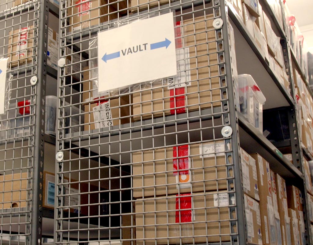 Caged vault shelving used for secure cannabis product storage, meeting 2026 state regulations for restricted access and high-security storage requirements.